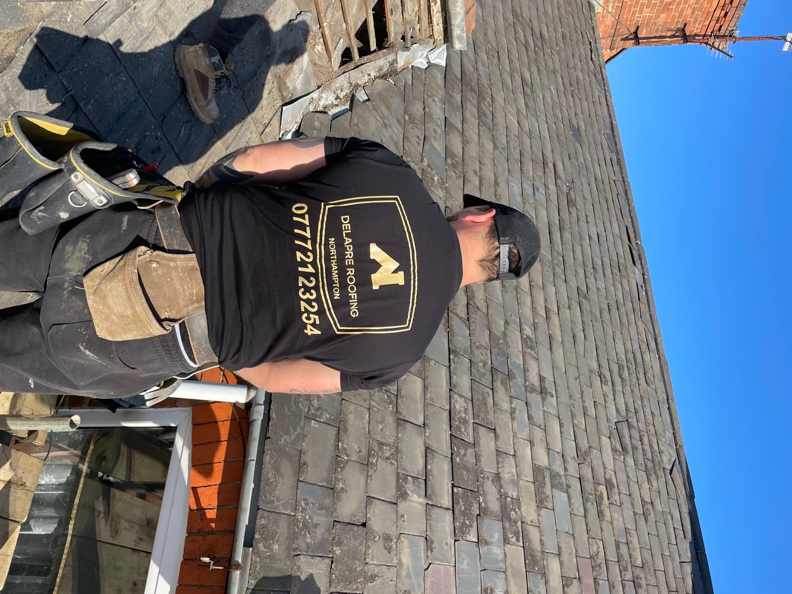 Delapre Roofing roofer working on a slate roof